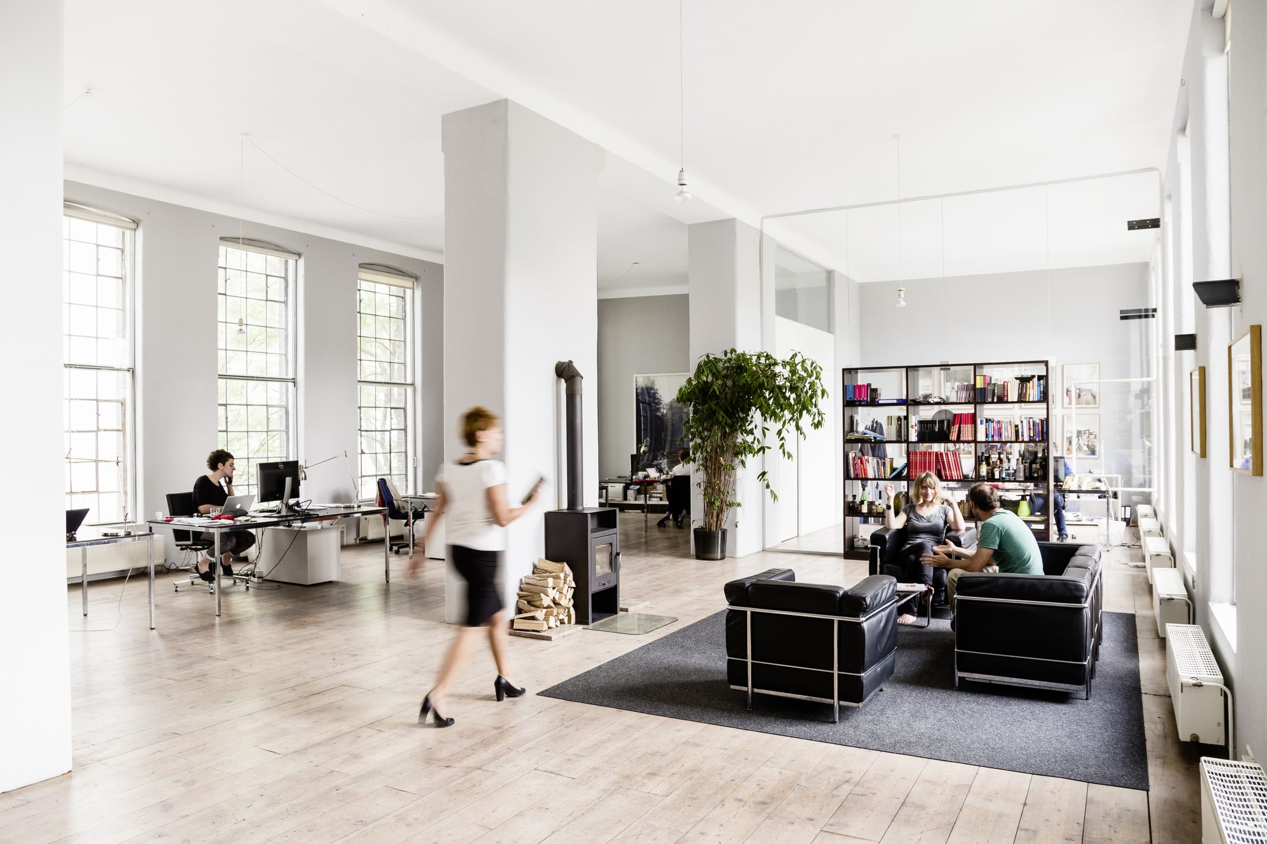 Open-plan office at FONDA in a bright loft with large windows